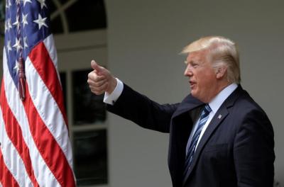 U.S. President Donald Trump gives a thumbs up during a National Day of Prayer event at the Rose Garden of the White House in Washington D.C., U.S., on May 4, 2017.
