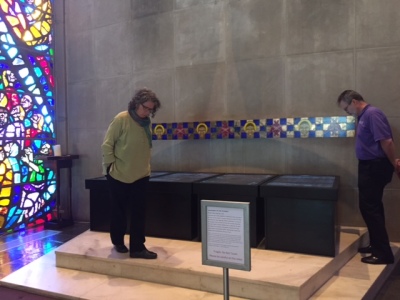 Visitors look at the new media art work 'Lamentation for the Forsaken' by Michael Takeo Magruder, which went on display at the Oxnam Chapel at Wesley Theological Seminary in Washington, DC from May 1-19, 2017.