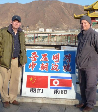 Paul Pennington of Hope for Orphans and Dr. Jeffery Paul, HFO Medical Director near the North Korean security processing area in Tumen China, looking into North Korea from the Chinese side in 2011.