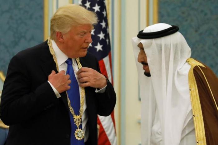 Saudi Arabia's King Salman bin Abdulaziz Al Saud (R) presents U.S. President Donald Trump with the Collar of Abdulaziz Al Saud Medal at the Royal Court in Riyadh, Saudi Arabia, May 20, 2017.