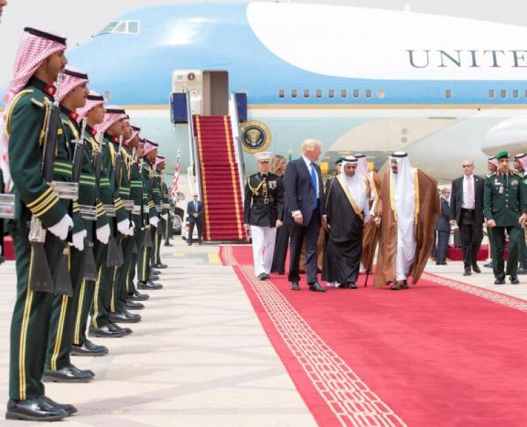 Saudi Arabia's King Salman bin Abdulaziz Al Saud and U.S. President Donald Trump walk during a reception ceremony in Riyadh, Saudi Arabia, May 20, 2017.