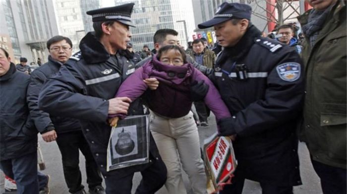 Chinese police arrest an activist who was reportedly calling for more transparency and less corruption in the government.
