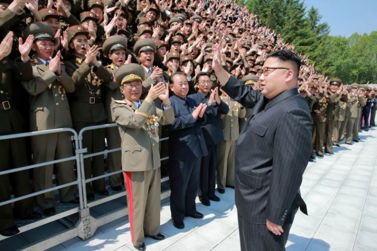 North Korean leader Kim Jong Un waves to North Korean scientists and technicians, who developed missile 'Hwasong-12' in this undated photo released by North Korea's Korean Central News Agency (KCNA), May 20, 2017.