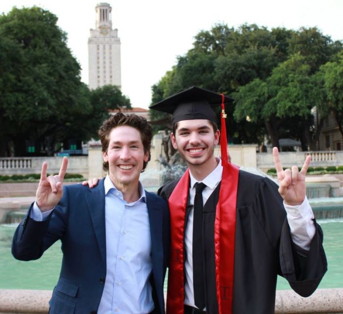 Evangelist Joel Osteen poses with his son, Jonathan, after a graduation ceremony at the University of Texas at Austin on May 20, 2017.