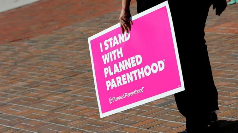 A sign in support of Planned Parenthood is seen outside a town hall meeting for Republican U.S. Senator Bill Cassidy in Metairie, Louisiana, U.S. February 22, 2017.
