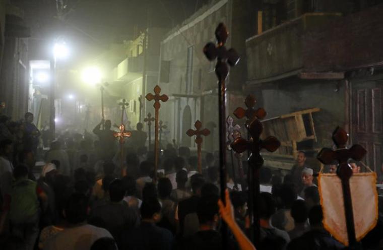 Mourners carry crosses and march after the funeral of Coptic Christians who were killed on Friday in Minya, Egypt, May 26, 2017.