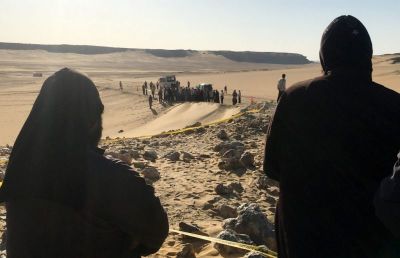 Monks look at the view following a gunmen attack against a group of Coptic Christians traveling to a monastery in southern Egypt, in Minya, May 26, 2017.