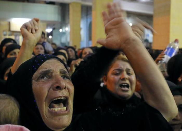Relatives of victims of an attack that killed at least 28 Coptic Christians on Friday react at the funeral in Minya, Egypt May 26, 2017.
