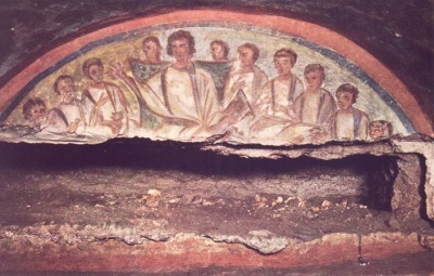 A fresco found in the Domitilla Catacombs depicting Christ with his disciples.