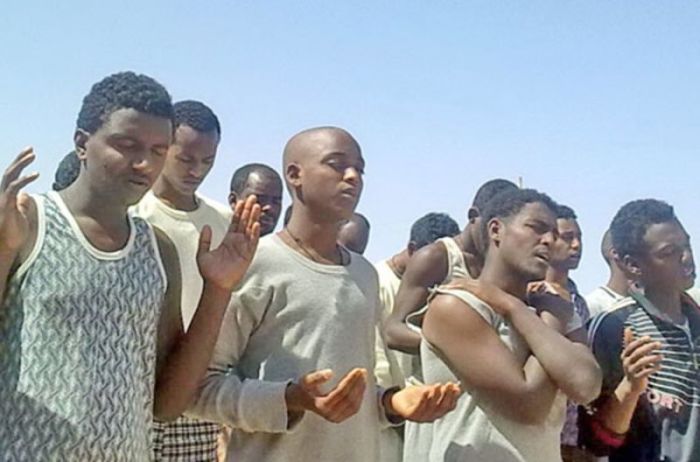 Eritrean Christians in Egyptian prison worship together.