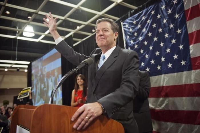 Republican Kansas Governor Sam Brownback speaks to supporters after winning re-election in the U.S. midterm elections in Topeka, Kansas on Nov. 4, 2014.