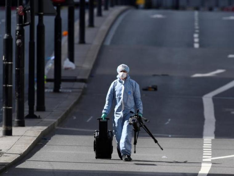 A police forensics investigator works on London Bridge after an attack left seven people dead and dozens injured in London, Britain, June 4, 2017.