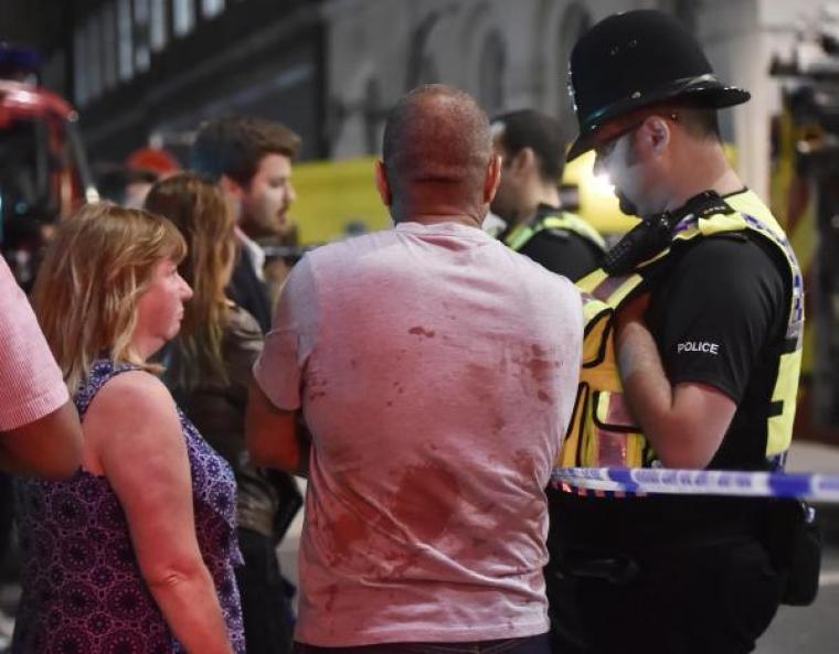 People speak with police officers after an incident near London Bridge in London, Britain, June 4, 2017.