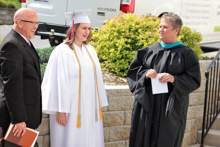 Maddi Runkles, 18 (C), the Heritage Academy student who was barred from attending the small Christian school's graduation ceremony because she got pregnant, graduated in a small private ceremony attended by family and friends on Saturday June 3, 2017.