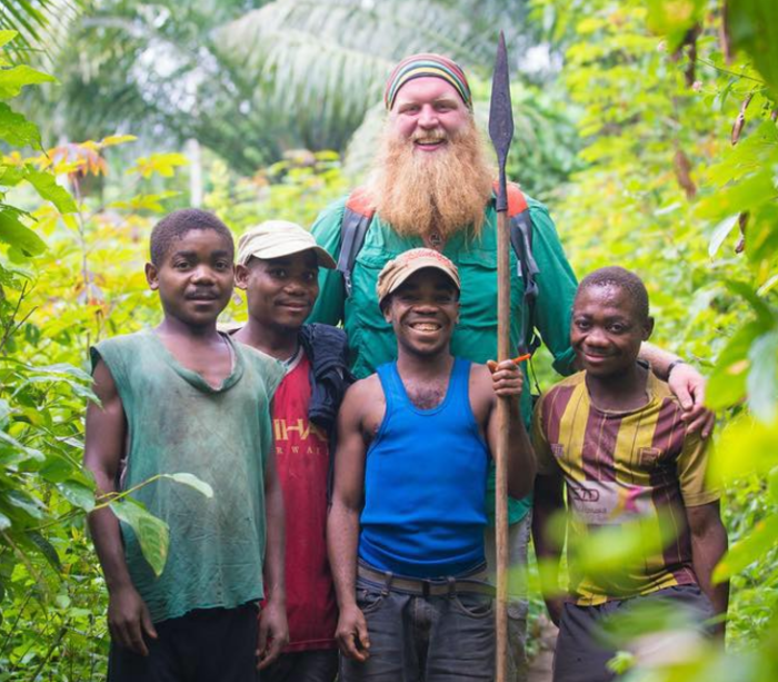 Christian MMA fighter Justin Wren pictured with members of the Mbuti Pygmy people of the Congo.