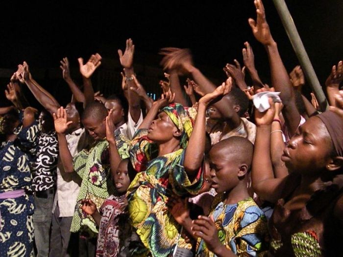 Worshippers demonstrate their faith during a church service in Nigeria.