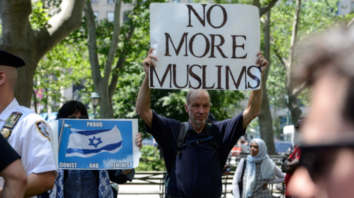 A man holds a placard during an event called 'March Against Sharia' in New York City on June 10, 2017