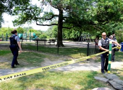 Police put up tape to clear journalists from the outfield area of a baseball field where shots were fired during a congressional baseball practice, wounding House Majority Whip Steve Scalise (R-LA), in Alexandria, Virginia, on June 14, 2017.