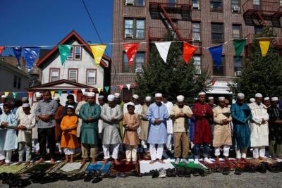 Muslim men attend Eid al-Fitr prayers to mark the end of the holy fasting month of Ramadan in the Queens borough of New York, July 6, 2016.