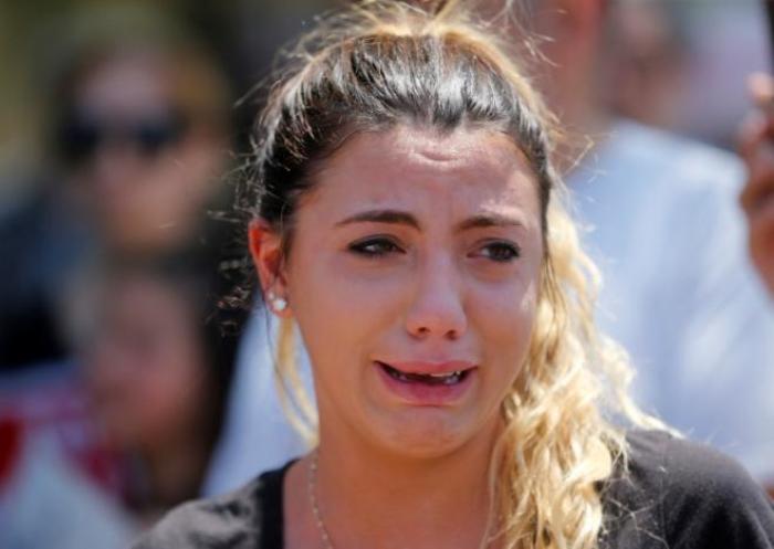Chaldean-American Lavrena Kenawa cries as she thinks about her uncle who was seized on Sunday by Immigration and Customs Enforcement agents during a rally outside the Mother of God Catholic Chaldean church in Southfield, Michigan, U.S., June 12, 2017.