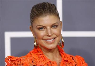Singer Fergie, of The Black Eyed Peas, arrives at the 54th annual Grammy Awards in Los Angeles, California, February 12, 2012.