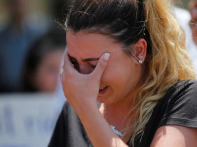 Chaldean-American Lavrena Kenawa cries as she thinks about her uncle who was seized Sunday by Immigration and Customs Enforcement agents during a rally outside the Mother of God Catholic Chaldean church in Southfield, Michigan, U.S., June 12, 2017.