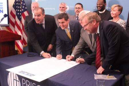 Christian leaders sign the "Justice Declaration" at the National Press Club in Washington, D.C. on June 20, 2017. From left to right: Prison Fellowship CEO James Ackerman, Southern Baptist ethicist Russell Moore, National Association of Evangelicals President Leith Anderson and Colson Center for Christian Worldview Vice President of Communications David Carlson.