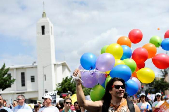 People participate in a Resist March that replaced the annual Pride Parade in Los Angeles, California, U.S., June 11, 2017.