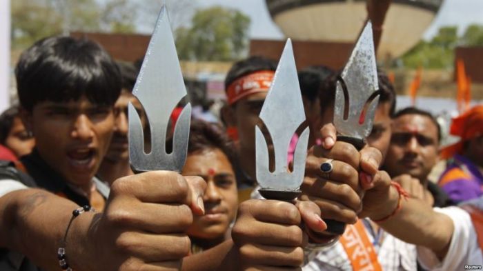 Supporters of hardline Vishwa Hindu Parishad Hindu group hold tridents in the western Indian city of Ahmedabad, India.