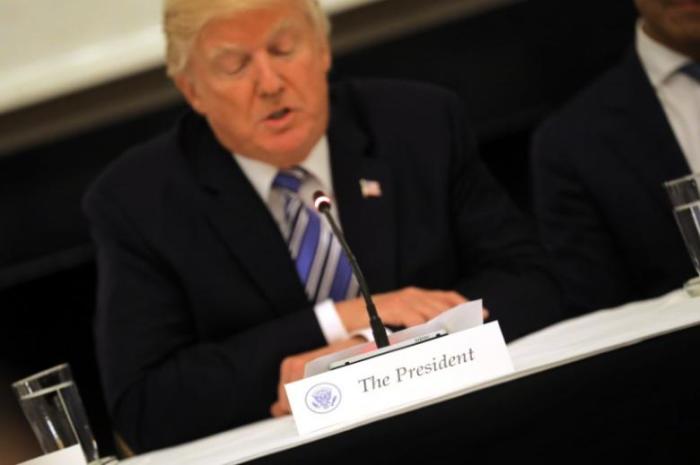 The image features U.S. President Donald Trump speaking during the recent meeting with tech giants at the White House.