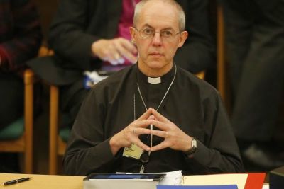 The Archbishop of Canterbury, Justin Welby, pauses at the start of the day's proceedings at the General Synod, in Church House in central London on Nov. 20, 2013.