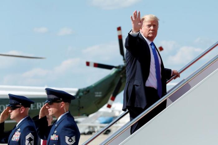 U.S. President Donald Trump waves as he boards Air Force One at Joint Base Andrews outside Washington, U.S., June 9, 2017.