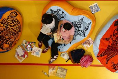 Children read books at Birmingham Library in central England September 3, 2013.