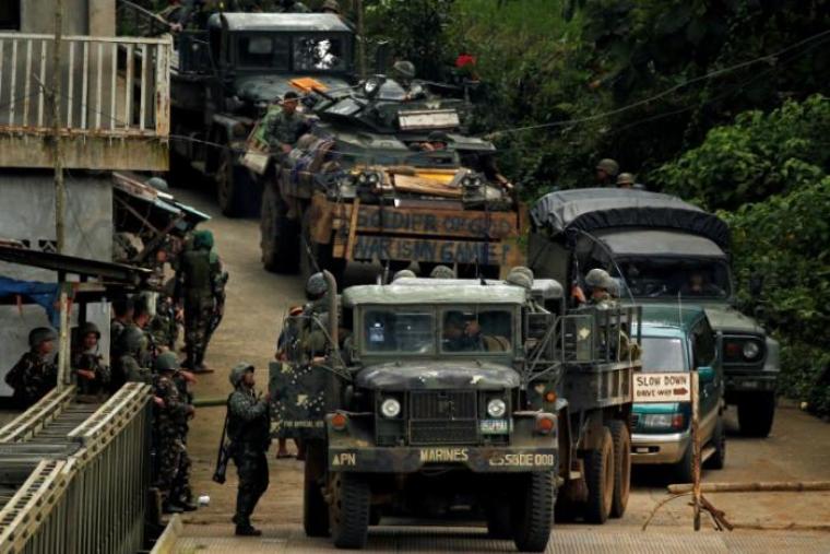 Philippines army soldiers return from an operation to retrieve bodies of casualties from the fighting zone in Marawi City, Philippines June 28, 2017.