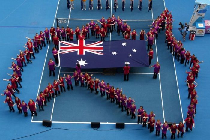 People form the shape of Australia during the Australian Open in Melbourne on January 26, 2011.