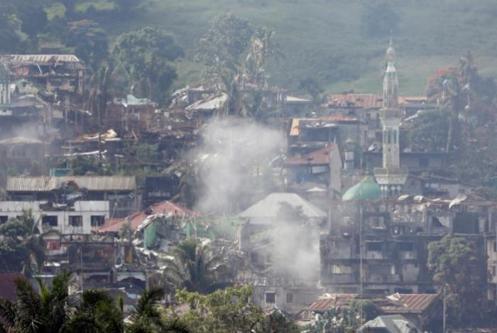 Smoke is seen while Philippines army troops continue their assault against insurgents from the Maute group in Marawi City, Philippines, June 28, 2017.