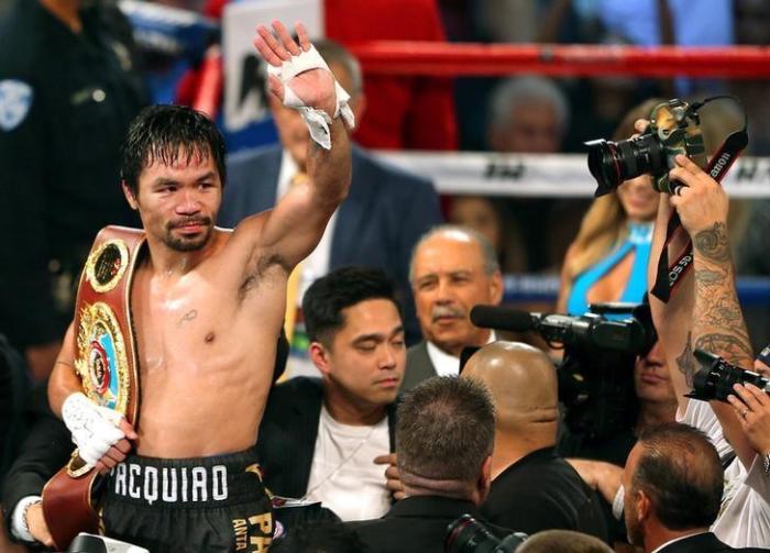 Manny Pacquiao of the Philippines celebrates after defeating Jessie Vargas of Las Vegas to become WBO welterweight champion at the Thomas & Mack Center in Las Vegas, Nevada, U.S., November 5, 2016. It is predicted that the Filipino boxing legend will once again prove his supremacy as he faces Jeff Horn in Brisbane, Australia tonight.