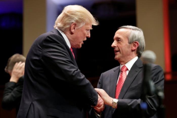 U.S. President Donald Trump (L) is greeted by Pastor Jeffress at the Celebrate Freedom Rally in Washington, D.C.,on July 1, 2017.