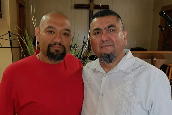 Pastor Basilio Montez (R) of Holy Ground Baptist Church in Cameron, Texas, and his congregant, Jesus Cerecerez (L).