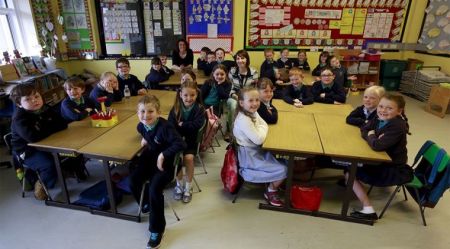 British school children inside their classroom.