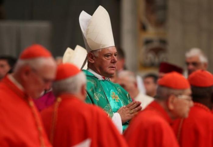 Newly elected cardinal Gerhard Ludwig Muller of Germany arrives during a consistory ceremony led by Pope Francis in Saint Peter's Basilica at the Vatican, February 22, 2014.