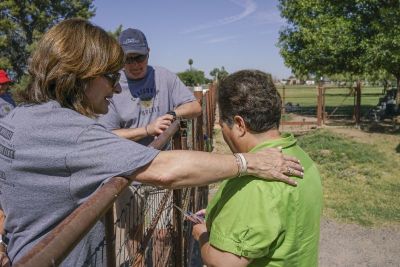 Donna Gaines, front left, and her husband, Steve, pastor of Bellevue Baptist Church near Memphis, Tenn., and president of the Southern Baptist Convention, pray with a woman in Laveen, Ariz., on Saturday, June 10, 2017 near Phoenix. The Gaineses joined 75 students and alumni from Southwestern Baptist Theological Seminary who had been reaching out to the city throughout the week.