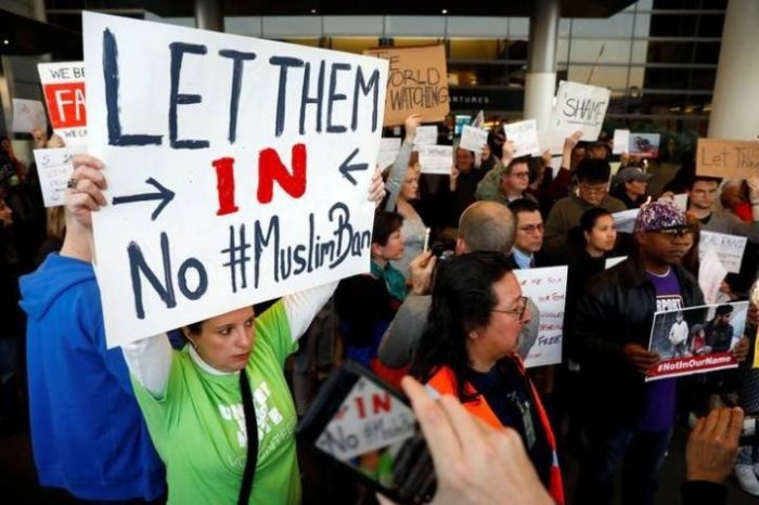 People protest Donald Trump's travel ban from Muslim majority countries at the International terminal at Los Angeles International Airport in Los Angeles, California, January 28, 2017.