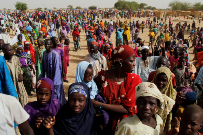 Nigerian refugees gather at the Boudouri site for displaced persons outside the town of Diffa in southeastern Niger, June 18, 2016.