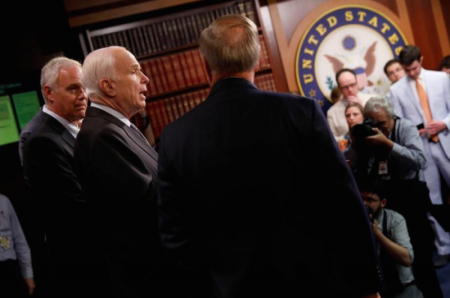 Senator John McCain (R-AZ), accompanied by Senator Ron Johnson (R-WI) and Senator Lindsey Graham (R-SC), speaks during a news conference about their resistance to the so-called "Skinny Repeal" of the Affordable Care Act on Capitol Hill in Washington, U.S., July 27, 2017.