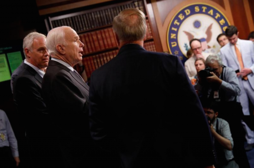 Senator John McCain (R-AZ), accompanied by Senator Ron Johnson (R-WI) and Senator Lindsey Graham (R-SC), speaks during a news conference about their resistance to the so-called "Skinny Repeal" of the Affordable Care Act on Capitol Hill in Washington, U.S., July 27, 2017.