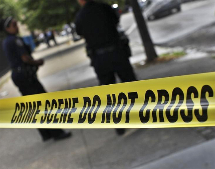 NYPD crime scene tape is seen at the site of a shooting at the corner of Marcus Garvey Blvd. and Pulaski Street in the Brooklyn borough of New York.