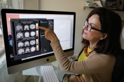 Dr. Ivanka Savic points to a study on the screen of her computer at her home in Los Angeles, California, U.S. June 30, 2017. Picture taken June 30, 2017.