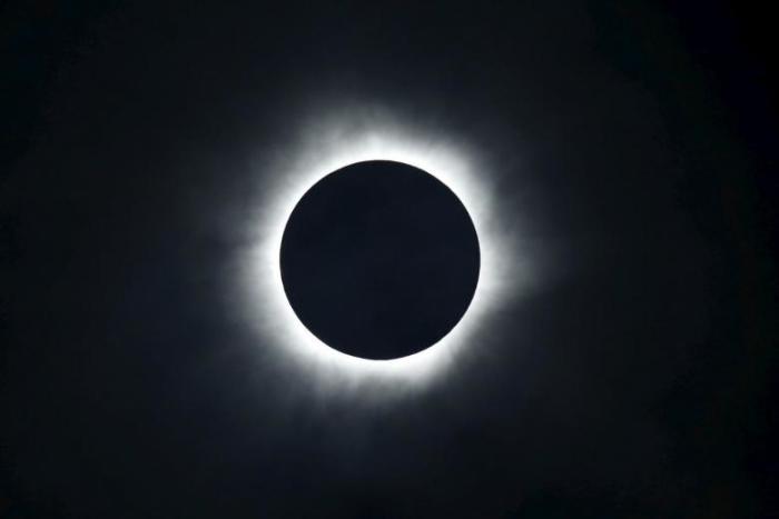A total solar eclipse is seen from the beach of Ternate island, Indonesia, March 9, 2016.