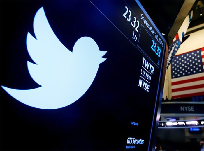The Twitter logo is displayed on a screen on the floor of the New York Stock Exchange (NYSE) in New York City, U.S.